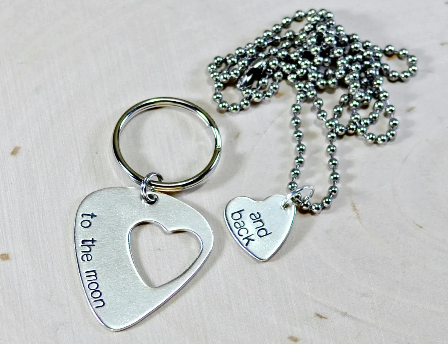 Couples sterling silver guitar pick keychain and necklace with love to the moon and back