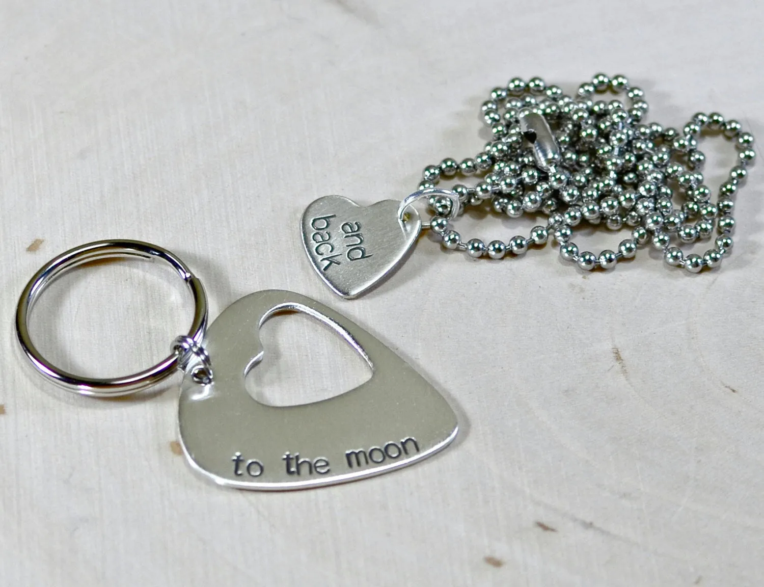 Couples sterling silver guitar pick keychain and necklace with love to the moon and back