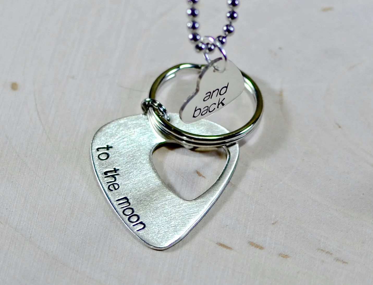 Couples sterling silver guitar pick keychain and necklace with love to the moon and back