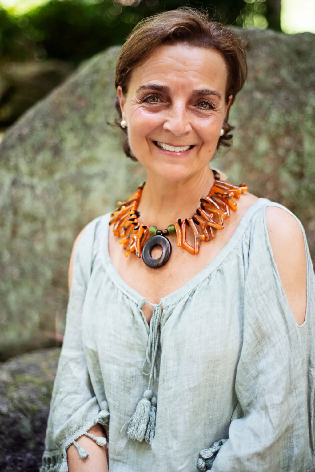 Necklace in coral orange shapes with ebony circle pendant