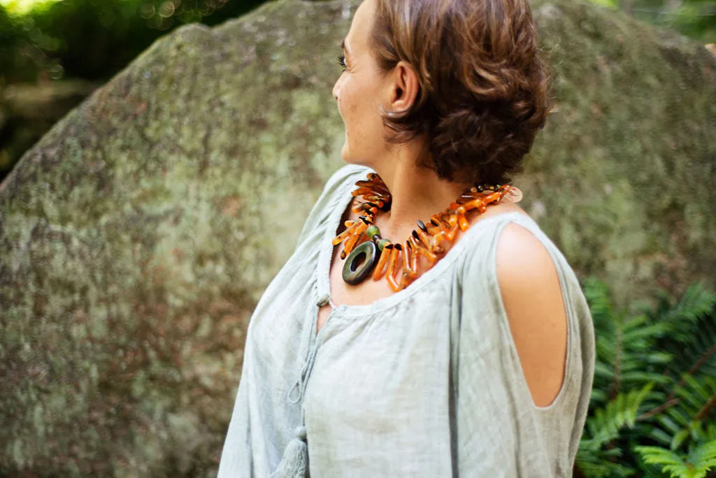 Necklace in coral orange shapes with ebony circle pendant
