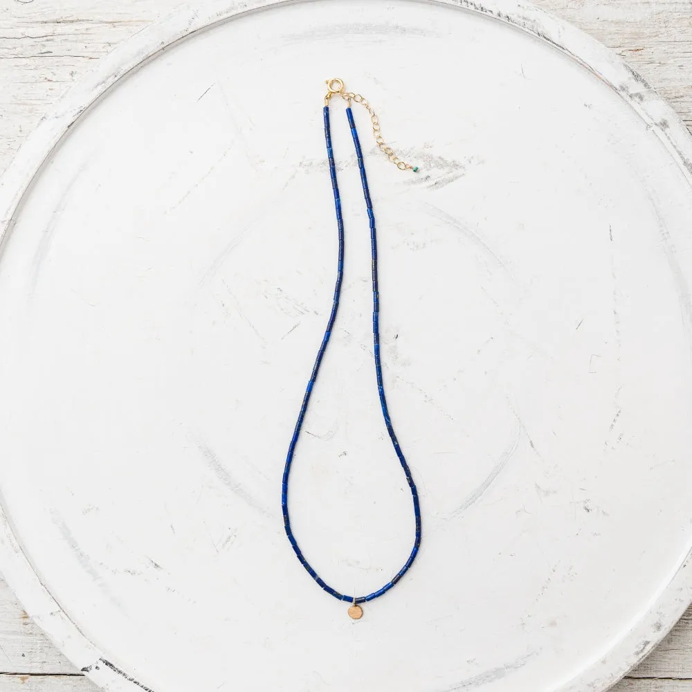 Petite Yellow Bronze Disc Necklace on Lapis Tube Strand