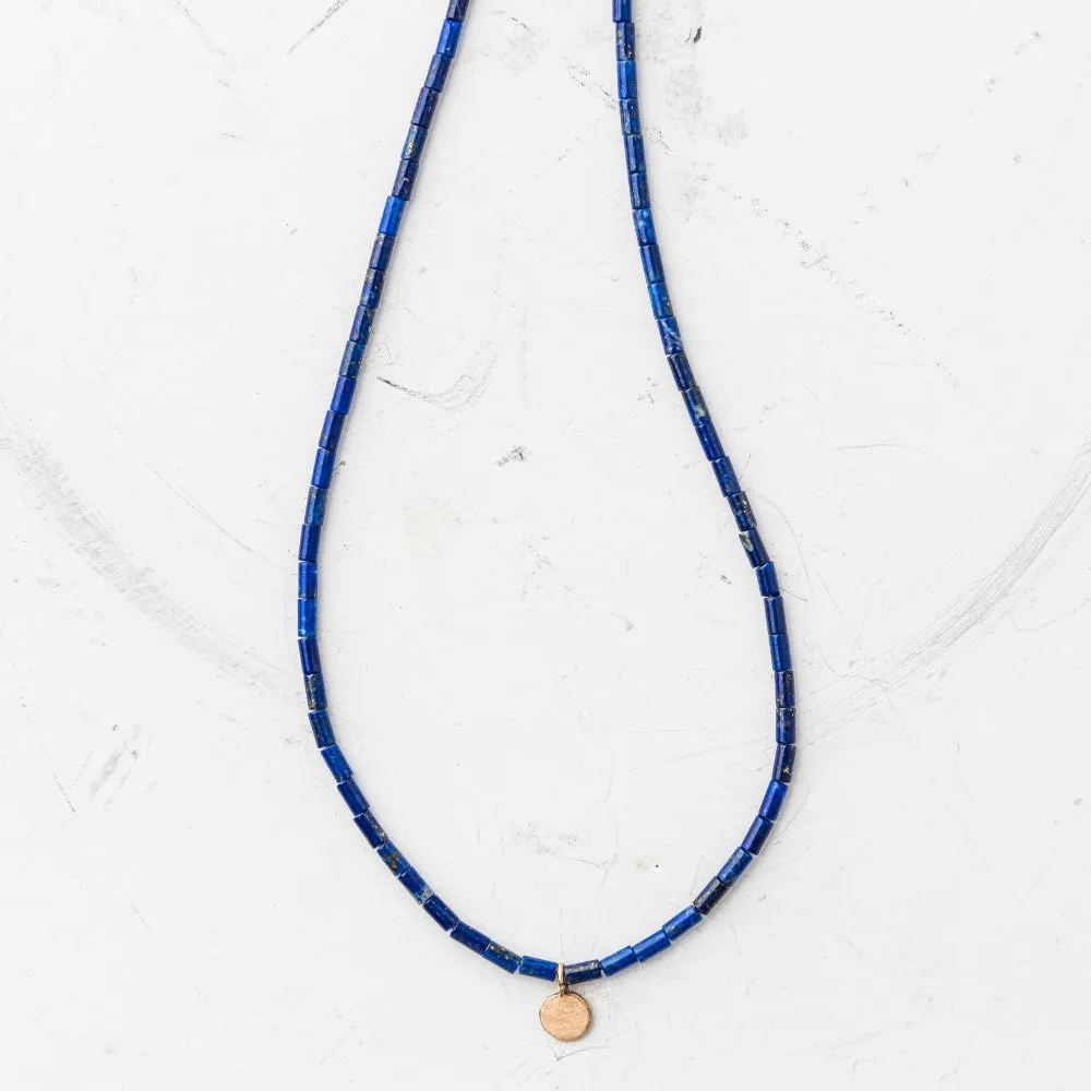Petite Yellow Bronze Disc Necklace on Lapis Tube Strand