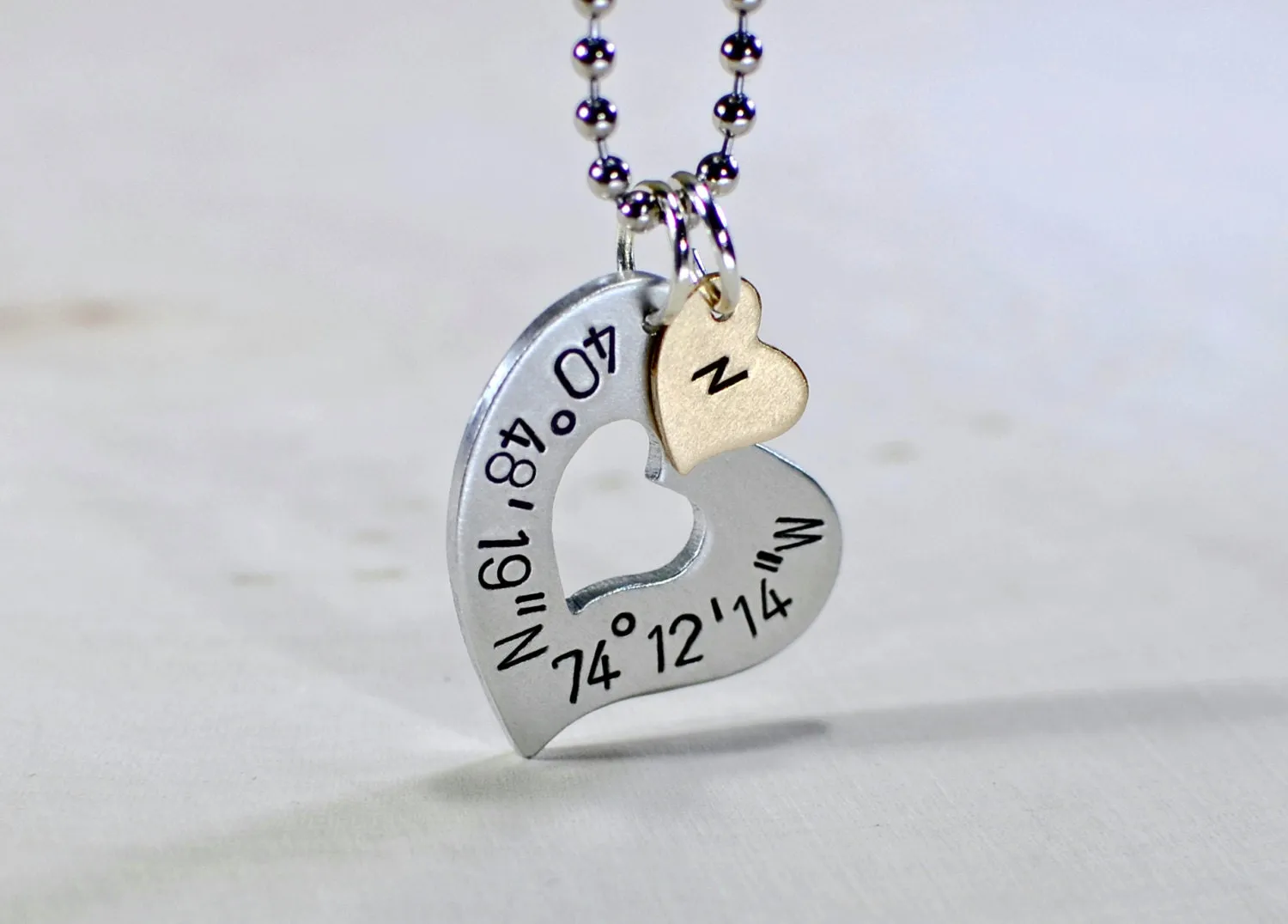 Sterling silver heart necklace with personalized latitude longitude coordinates with Bronze Heart Charm