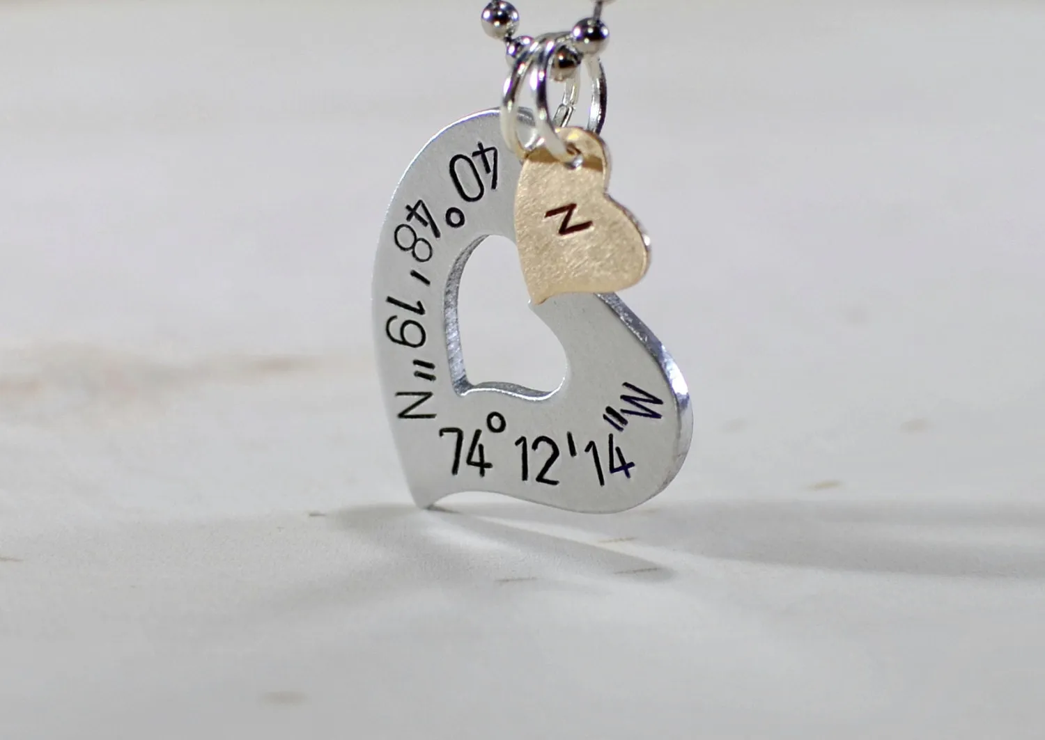 Sterling silver heart necklace with personalized latitude longitude coordinates with Bronze Heart Charm
