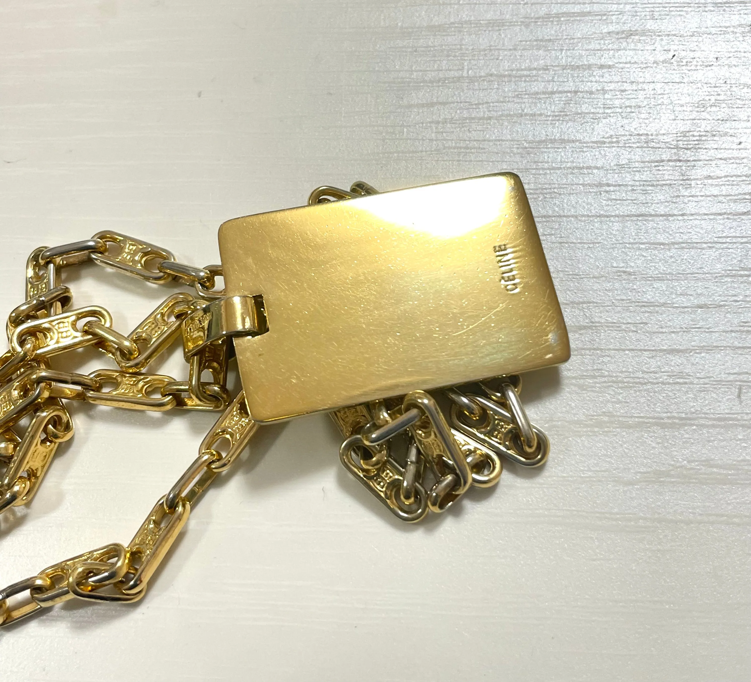 Vintage Celine golden necklace with triomphe chains and a carriage and logo featured rectangular plate top. 070218ys2
