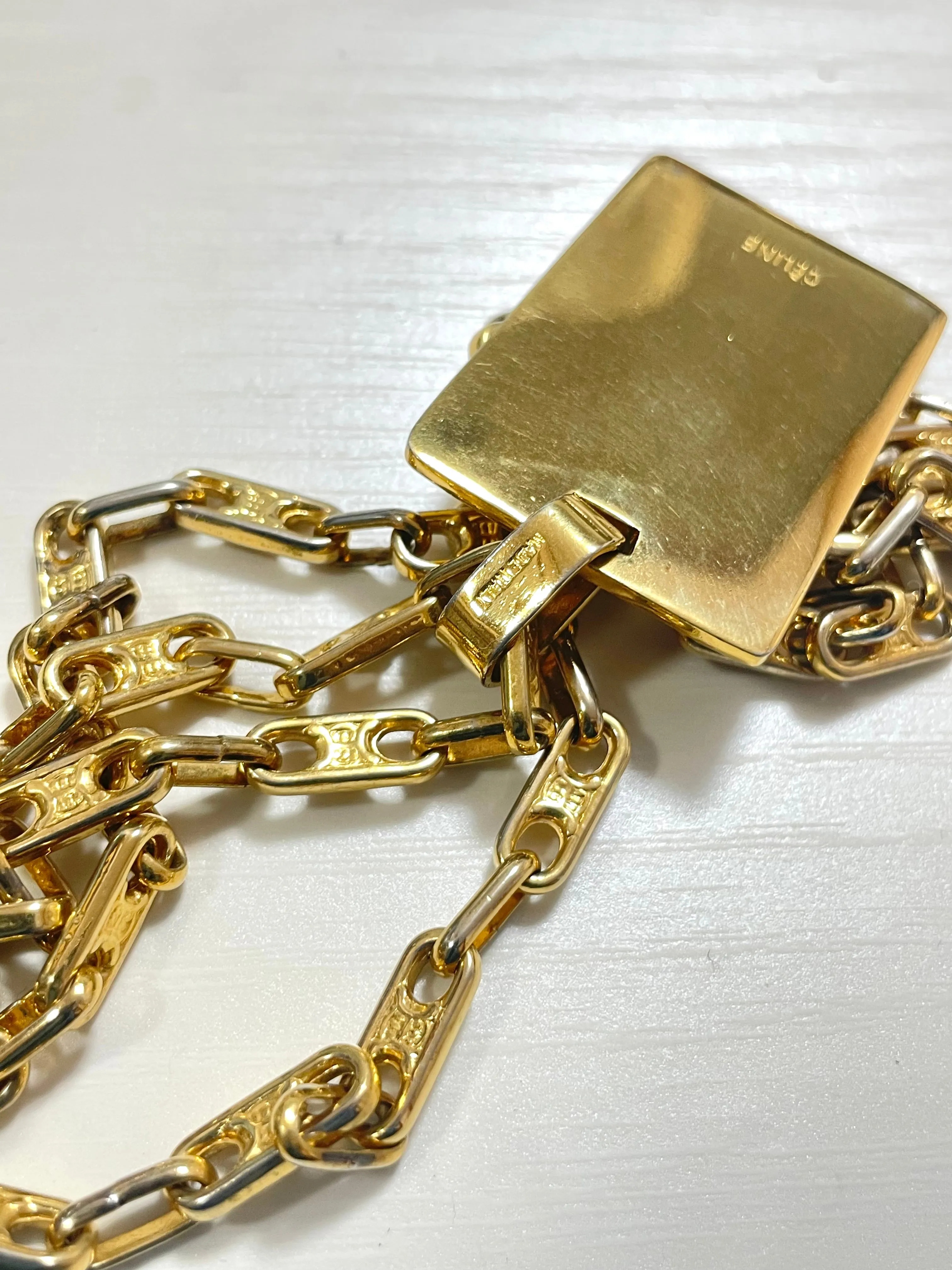 Vintage Celine golden necklace with triomphe chains and a carriage and logo featured rectangular plate top. 070218ys2