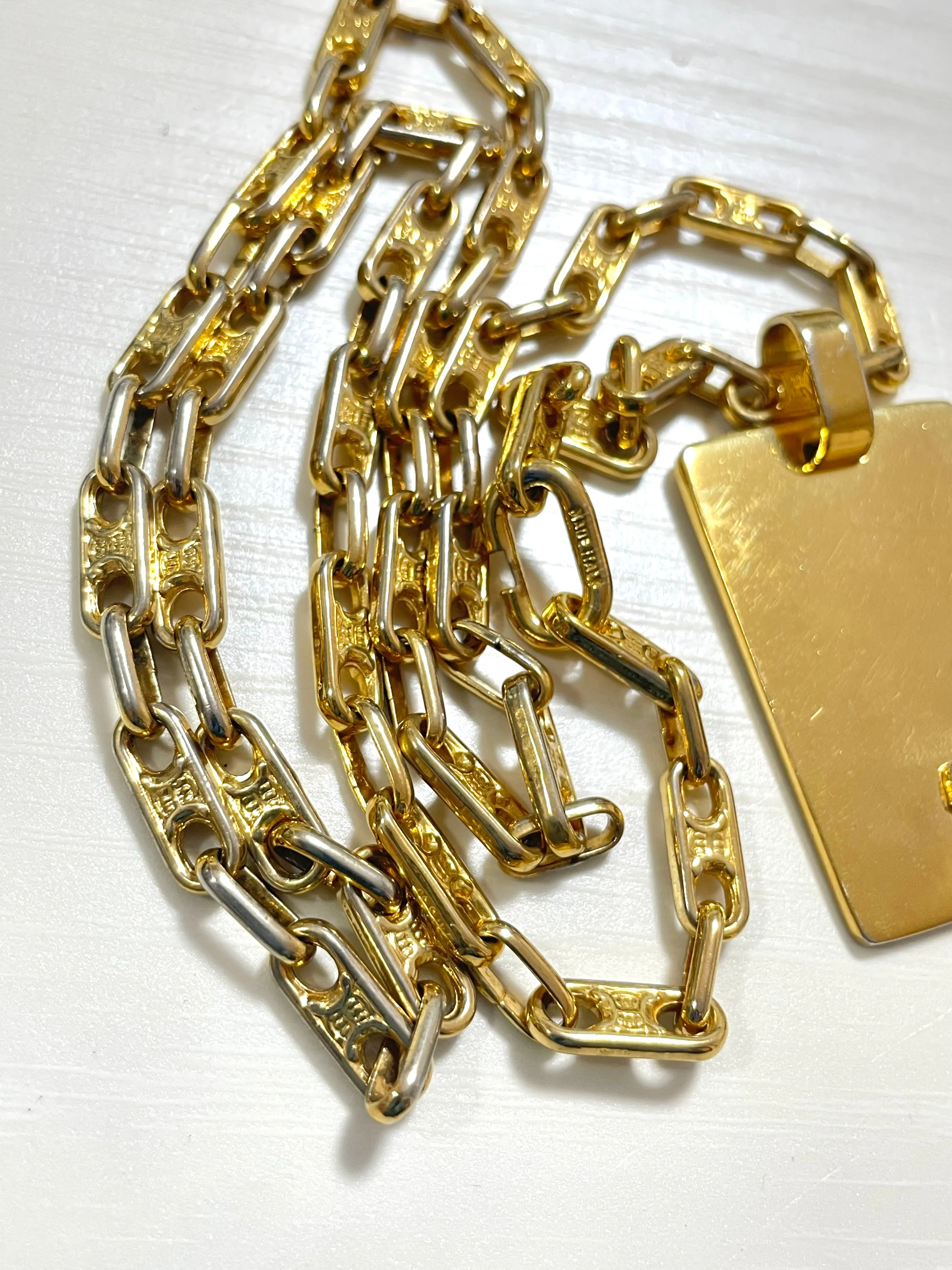 Vintage Celine golden necklace with triomphe chains and a carriage and logo featured rectangular plate top. 070218ys2