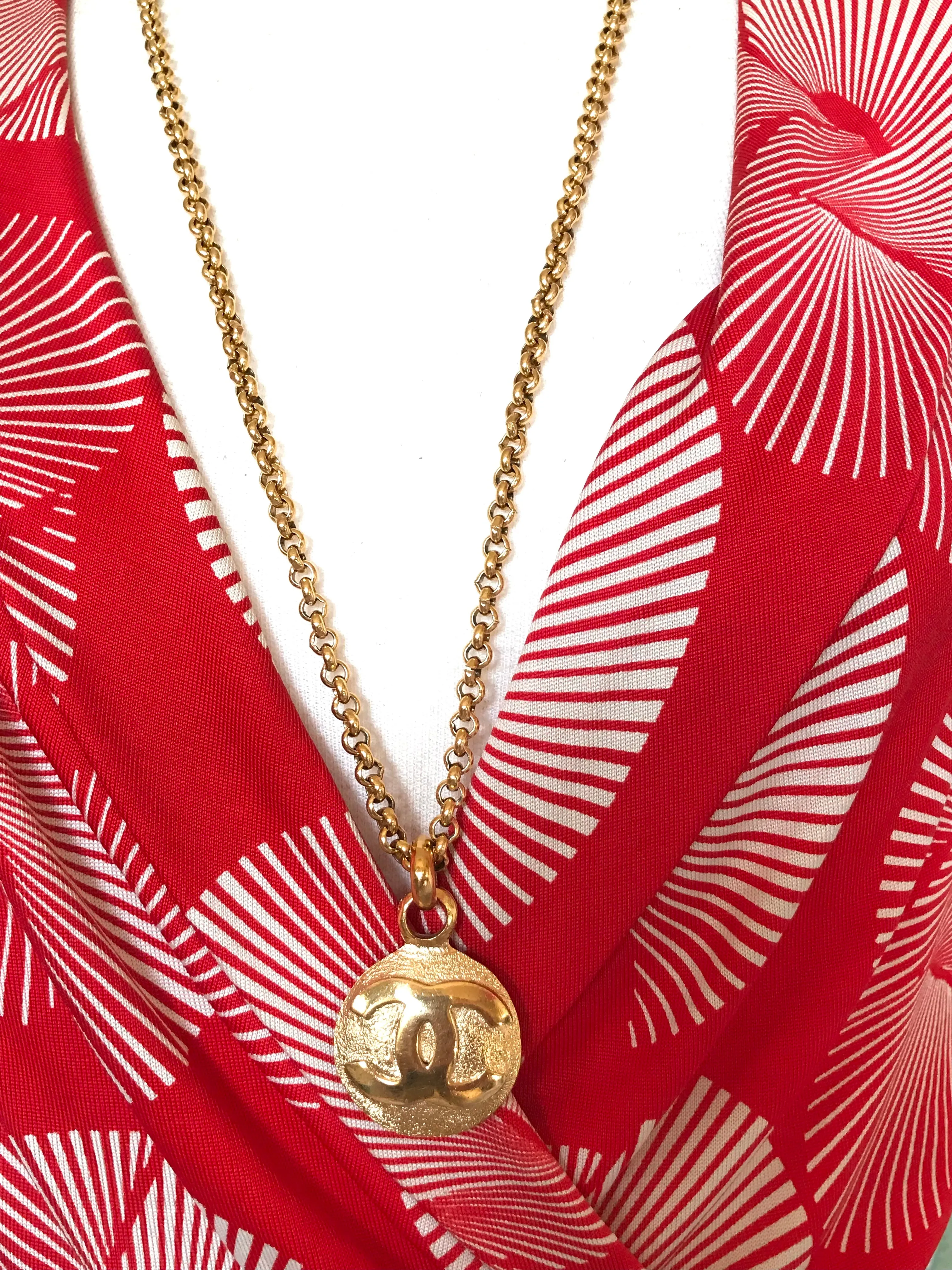 Vintage CHANEL golden chain necklace with round CC mark charm pendant top. Gorgeous jewelry. Best gift idea.