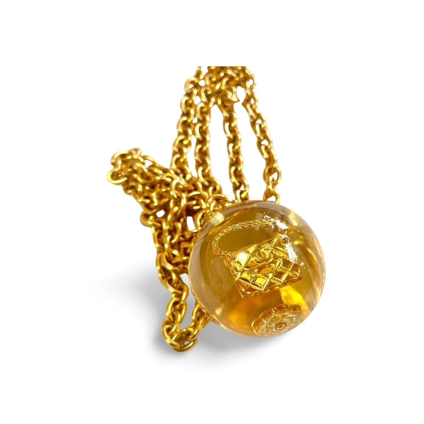 Vintage CHANEL long chain necklace with resin ball top, CC mark, turtle, camellia, clover, and 2.55 bag motifs in it. 060312ac4
